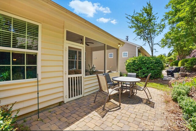 view of patio with ceiling fan and outdoor dining space