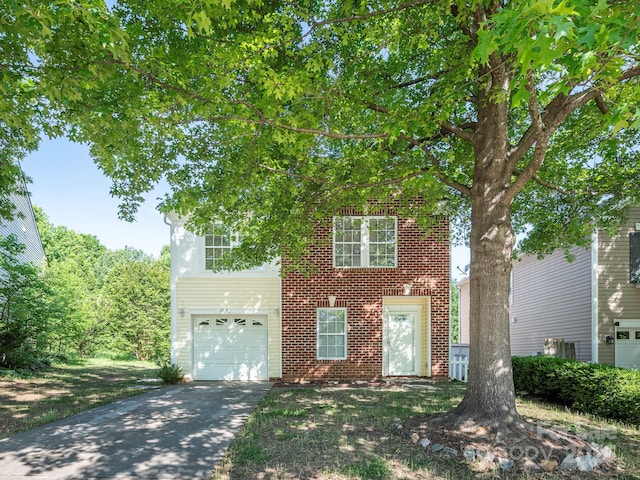 view of front of property featuring concrete driveway, brick siding, and an attached garage