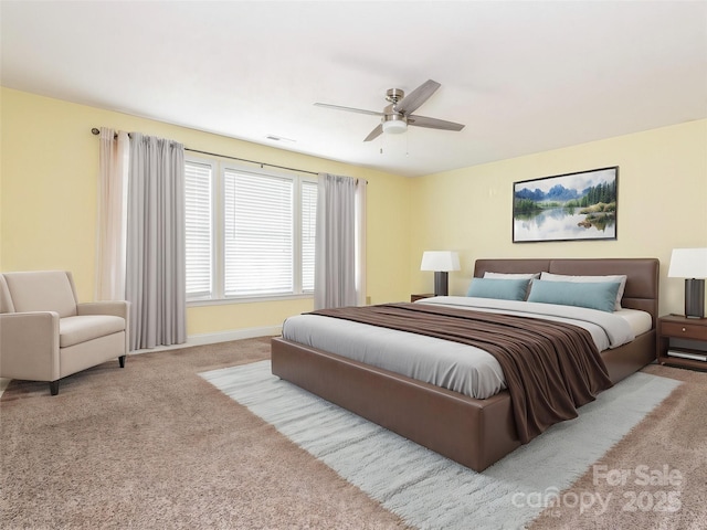 bedroom featuring a ceiling fan, baseboards, and carpet