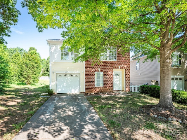 view of front facade featuring brick siding, a garage, and concrete driveway