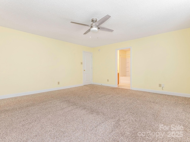 unfurnished room with a textured ceiling, ceiling fan, light carpet, and baseboards