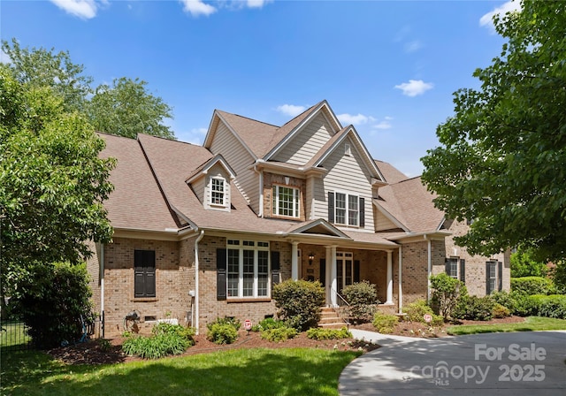 440 S Sharon Amity Rd, Charlotte, NC 28211 - view of front of home featuring brick siding, a shingled roof, and a front lawn