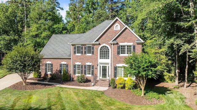2608 Carmarthen Ct, Matthews, NC 28104 - view of front facade featuring brick siding and a front yard