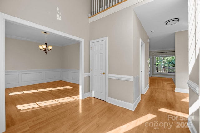 2608 Carmarthen Ct, Matthews, NC 28104 - foyer with wood finished floors, a chandelier, and a high ceiling