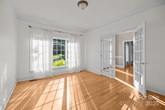 2608 Carmarthen Ct, Matthews, NC 28104 - spare room with ornamental molding, french doors, and light wood-type flooring