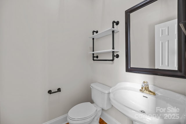 2608 Carmarthen Ct, Matthews, NC 28104 - half bathroom featuring a sink and toilet