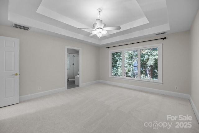 2608 Carmarthen Ct, Matthews, NC 28104 - unfurnished bedroom with a raised ceiling, carpet, and ensuite bath