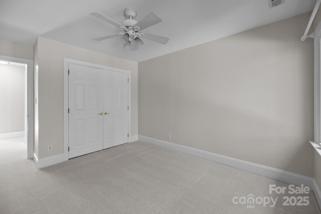 2608 Carmarthen Ct, Matthews, NC 28104 - unfurnished bedroom featuring carpet flooring, a closet, and a ceiling fan
