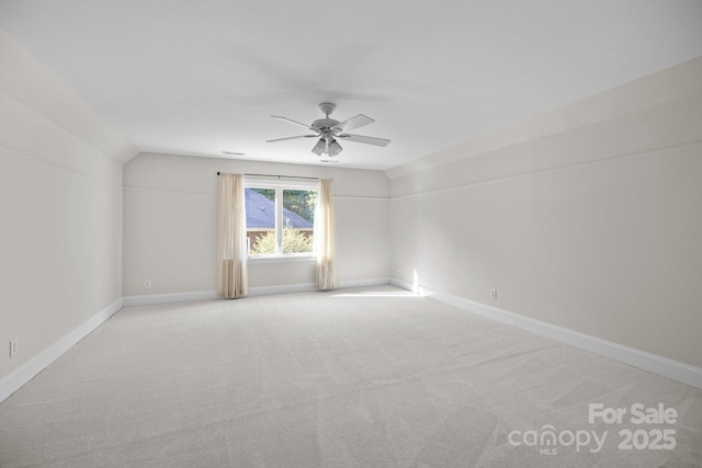 2608 Carmarthen Ct, Matthews, NC 28104 - unfurnished room with ceiling fan, light colored carpet, and vaulted ceiling