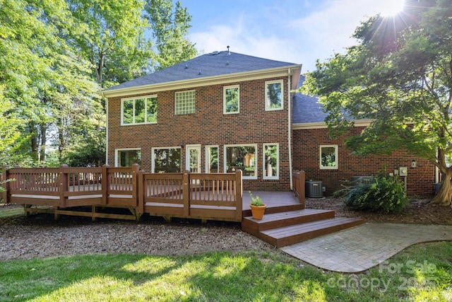 2608 Carmarthen Ct, Matthews, NC 28104 - rear view of property with brick siding, a deck, and roof with shingles