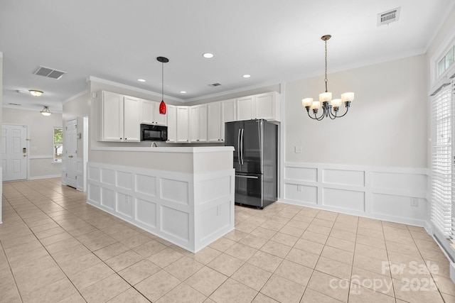 104 Clydesdale Ct, Matthews, NC 28104 - kitchen featuring freestanding refrigerator, black microwave, a decorative wall, light tile patterned floors, and ornamental molding