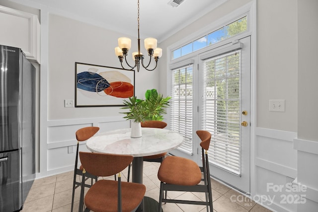 104 Clydesdale Ct, Matthews, NC 28104 - dining space with light tile patterned flooring, a chandelier, and built in features