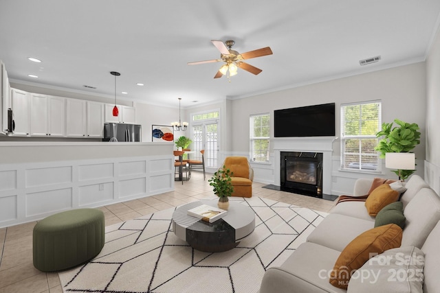 104 Clydesdale Ct, Matthews, NC 28104 - living room with light tile patterned floors, crown molding, a fireplace, ceiling fan, and recessed lighting