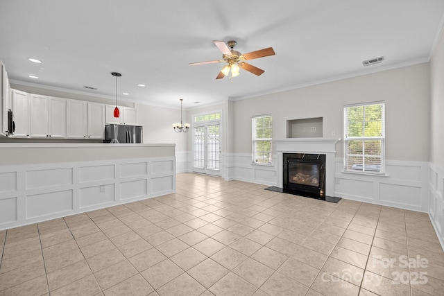 104 Clydesdale Ct, Matthews, NC 28104 - unfurnished living room featuring a decorative wall, light tile patterned flooring, a fireplace, a wainscoted wall, and ornamental molding
