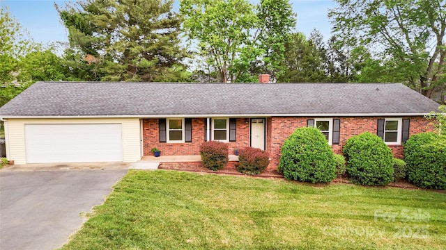 326 N Greenbriar Rd, Statesville, NC 28625 - single story home with brick siding, an attached garage, a front yard, and aphalt driveway