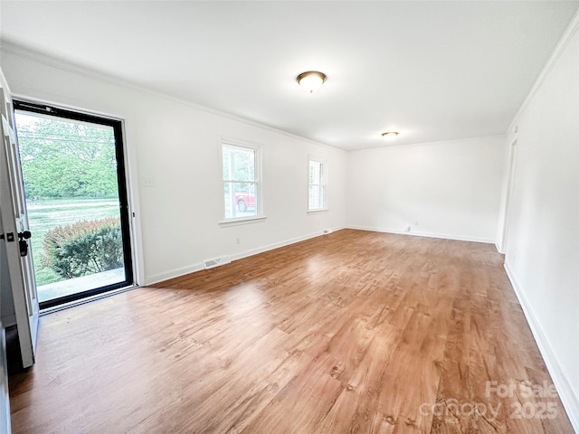 326 N Greenbriar Rd, Statesville, NC 28625 - unfurnished room featuring baseboards, ornamental molding, light wood finished floors, and visible vents