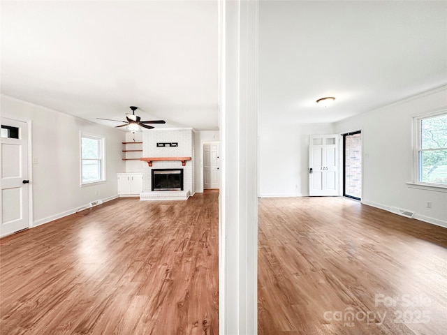 326 N Greenbriar Rd, Statesville, NC 28625 - unfurnished living room with a fireplace, baseboards, ceiling fan, and ornamental molding