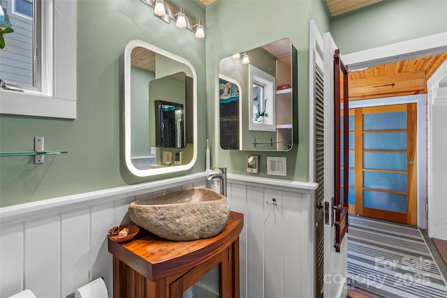 bathroom with vanity and wainscoting