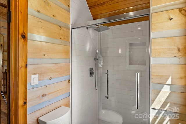 full bathroom with a shower stall and toilet