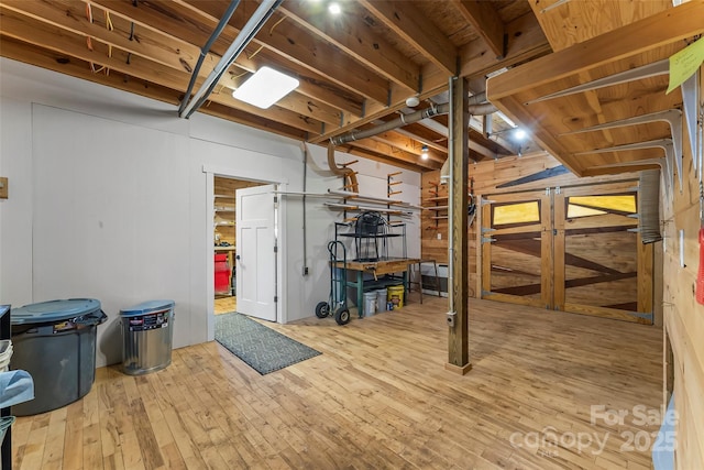 below grade area featuring hardwood / wood-style floors