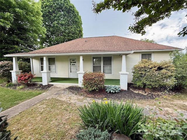 633 Ridge Rd, Marion, NC 28752 - view of front of house with a porch, a shingled roof, and a front lawn