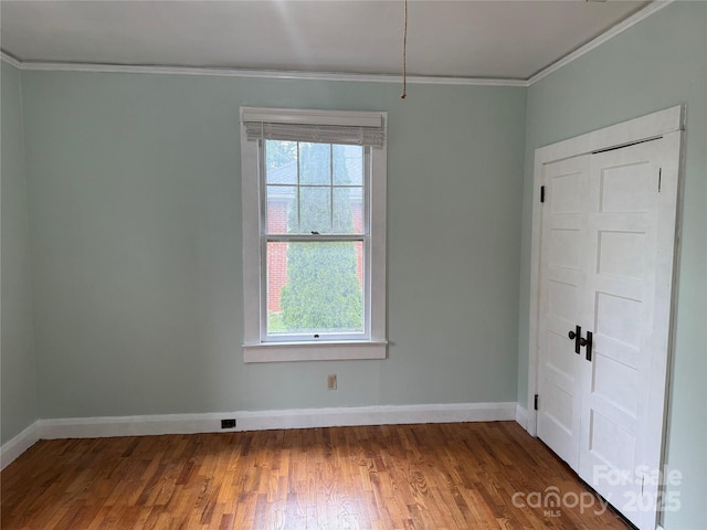 633 Ridge Rd, Marion, NC 28752 - spare room with plenty of natural light, ornamental molding, baseboards, and wood finished floors