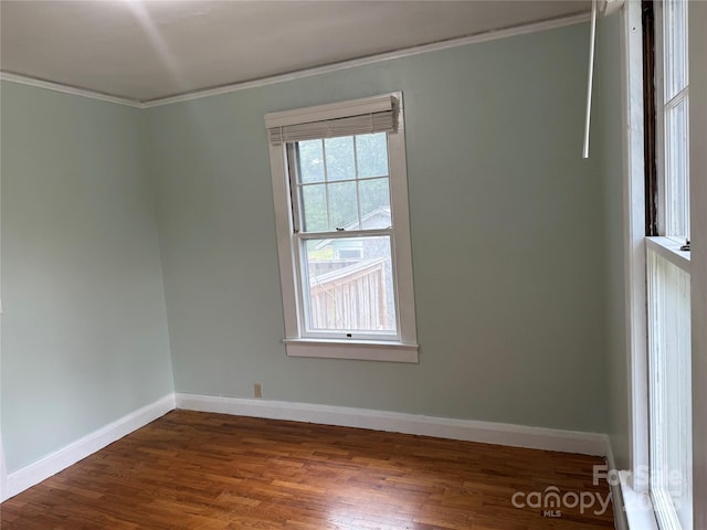 633 Ridge Rd, Marion, NC 28752 - empty room featuring baseboards, ornamental molding, and dark wood finished floors