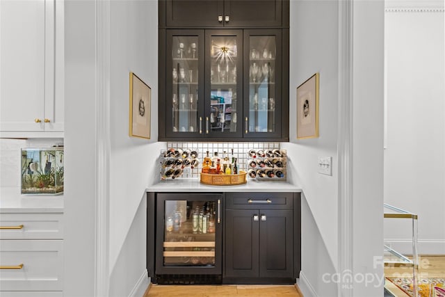 2509 Bay St, Charlotte, NC 28205 - indoor dry bar featuring beverage cooler, baseboards, and tasteful backsplash