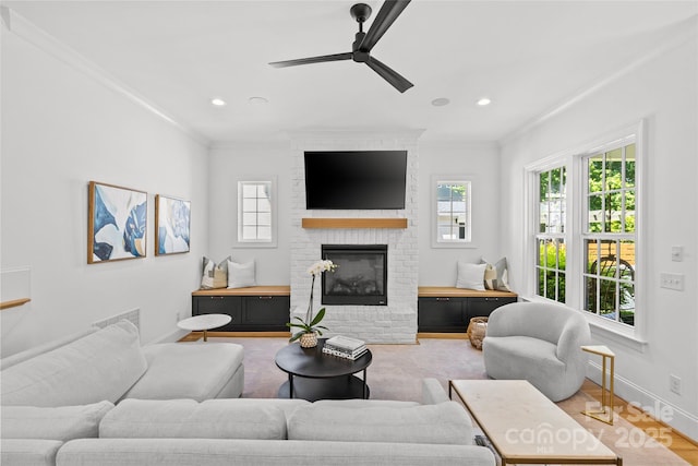 2509 Bay St, Charlotte, NC 28205 - living room featuring a ceiling fan, ornamental molding, a brick fireplace, baseboards, and recessed lighting