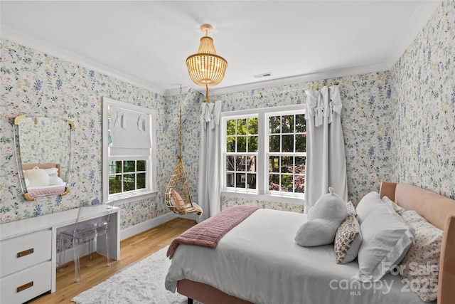 2509 Bay St, Charlotte, NC 28205 - bedroom featuring crown molding, wallpapered walls, wood finished floors, multiple windows, and baseboards