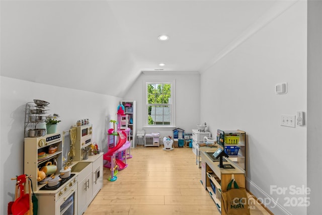 2509 Bay St, Charlotte, NC 28205 - rec room with light wood finished floors, recessed lighting, lofted ceiling, and ornamental molding