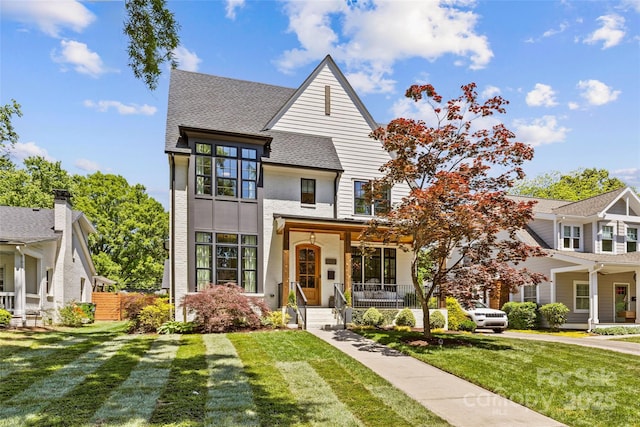 2509 Bay St, Charlotte, NC 28205 - view of front facade with a front lawn, roof with shingles, and stucco siding