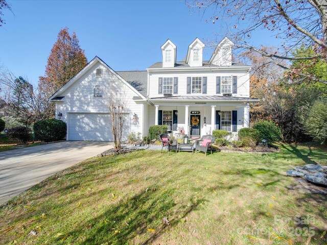 5076 Timber Falls Dr, Indian Land, SC 29707 - view of front of home featuring a porch, driveway, a front lawn, and a garage