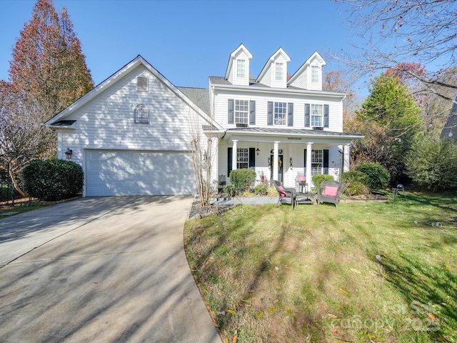5076 Timber Falls Dr, Indian Land, SC 29707 - view of front of property featuring covered porch, an attached garage, driveway, and a front lawn