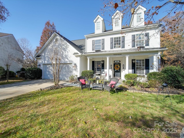 5076 Timber Falls Dr, Indian Land, SC 29707 - view of front of home with a garage, covered porch, driveway, and a front lawn