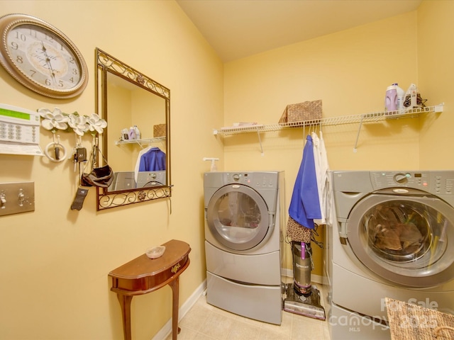 5076 Timber Falls Dr, Indian Land, SC 29707 - laundry room with laundry area, baseboards, tile patterned flooring, and washer and dryer