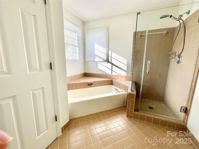 944 Evian Ln, Matthews, NC 28015 - full bathroom with tile patterned flooring, a bath, a stall shower, and a textured ceiling