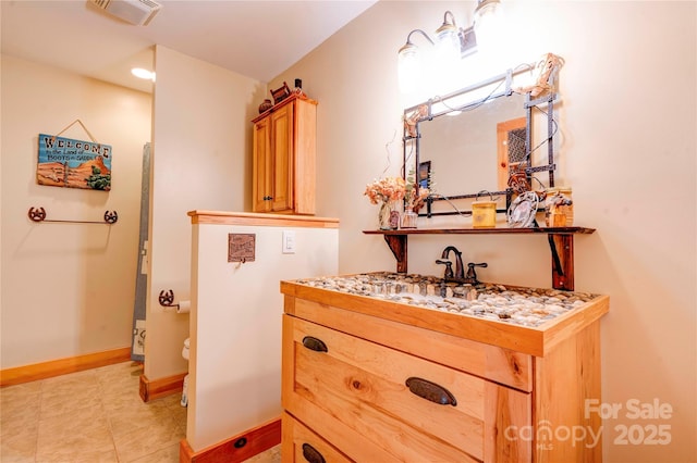 bathroom featuring visible vents, tile patterned flooring, vanity, toilet, and baseboards