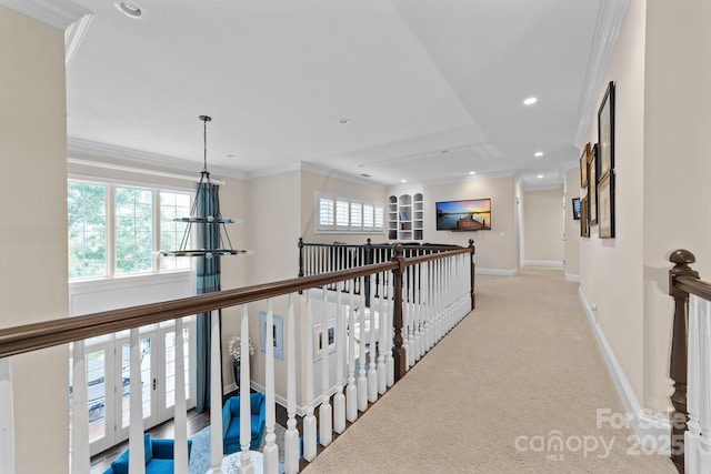 corridor with crown molding, recessed lighting, and an upstairs landing