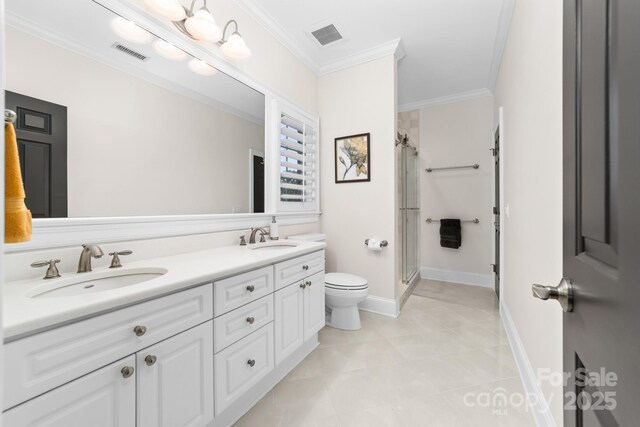 full bath featuring visible vents, crown molding, a stall shower, a sink, and toilet