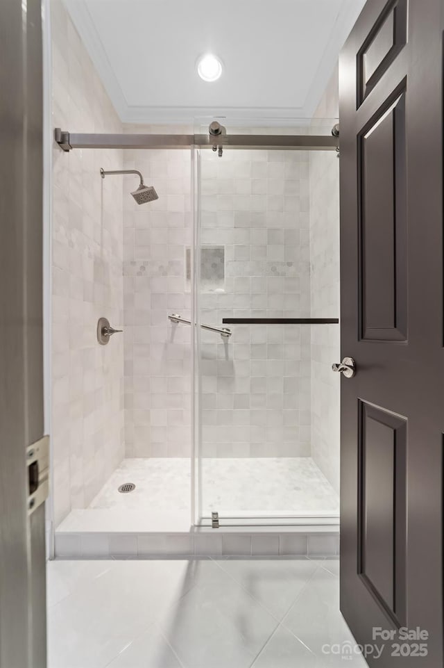 bathroom with recessed lighting, ornamental molding, tile patterned flooring, and a stall shower
