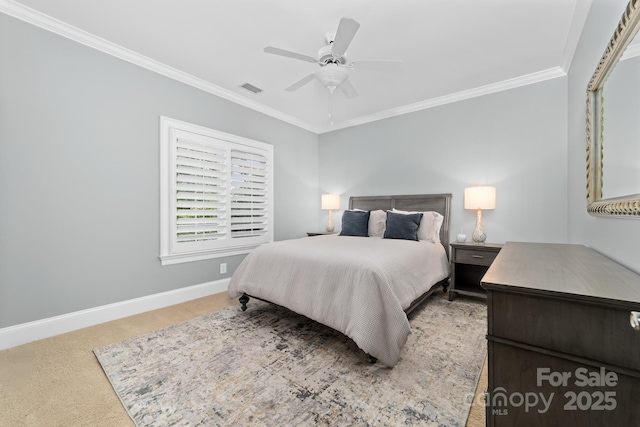 bedroom featuring baseboards, carpet, crown molding, and visible vents