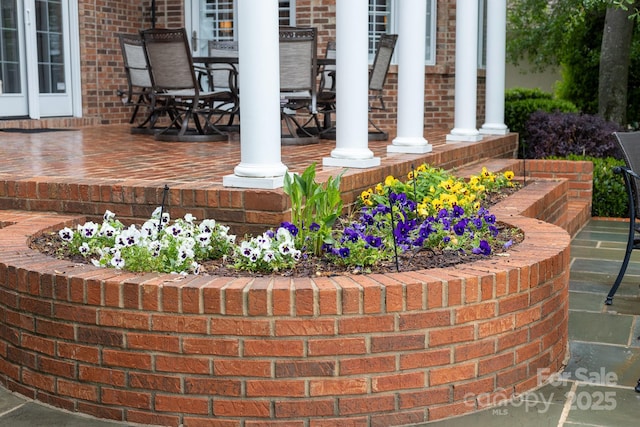 exterior space featuring brick siding