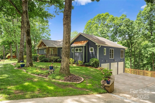 146 Paradise Peninsula Rd, Mooresville, NC 28117 - view of front of property featuring an attached garage, a front lawn, fence, and concrete driveway