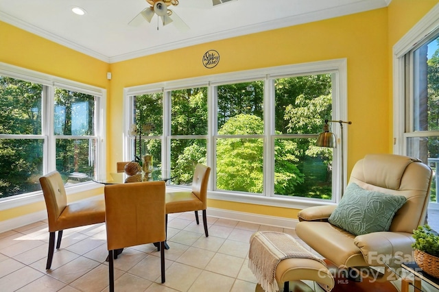 sunroom with crown molding, baseboards, tile patterned flooring, and visible vents