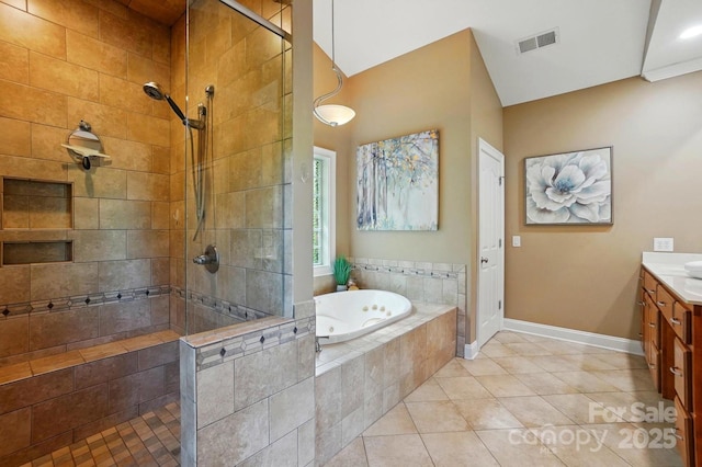 full bath featuring vanity, a jetted tub, baseboards, visible vents, and tiled shower