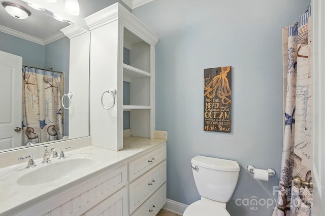 full bathroom featuring crown molding, vanity, and toilet