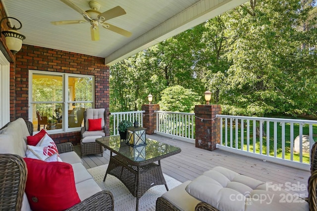 deck with ceiling fan and outdoor lounge area