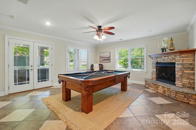 recreation room with a healthy amount of sunlight, baseboards, ornamental molding, and french doors