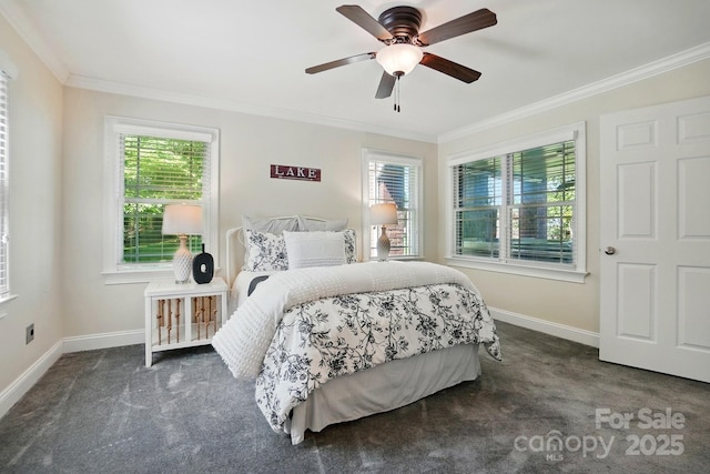 carpeted bedroom featuring crown molding, baseboards, and ceiling fan